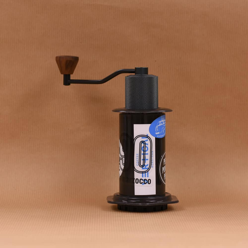 The Timemore Slim grinder fits in an AeroPress for travel and storage